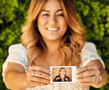 Woman holding a polaroid