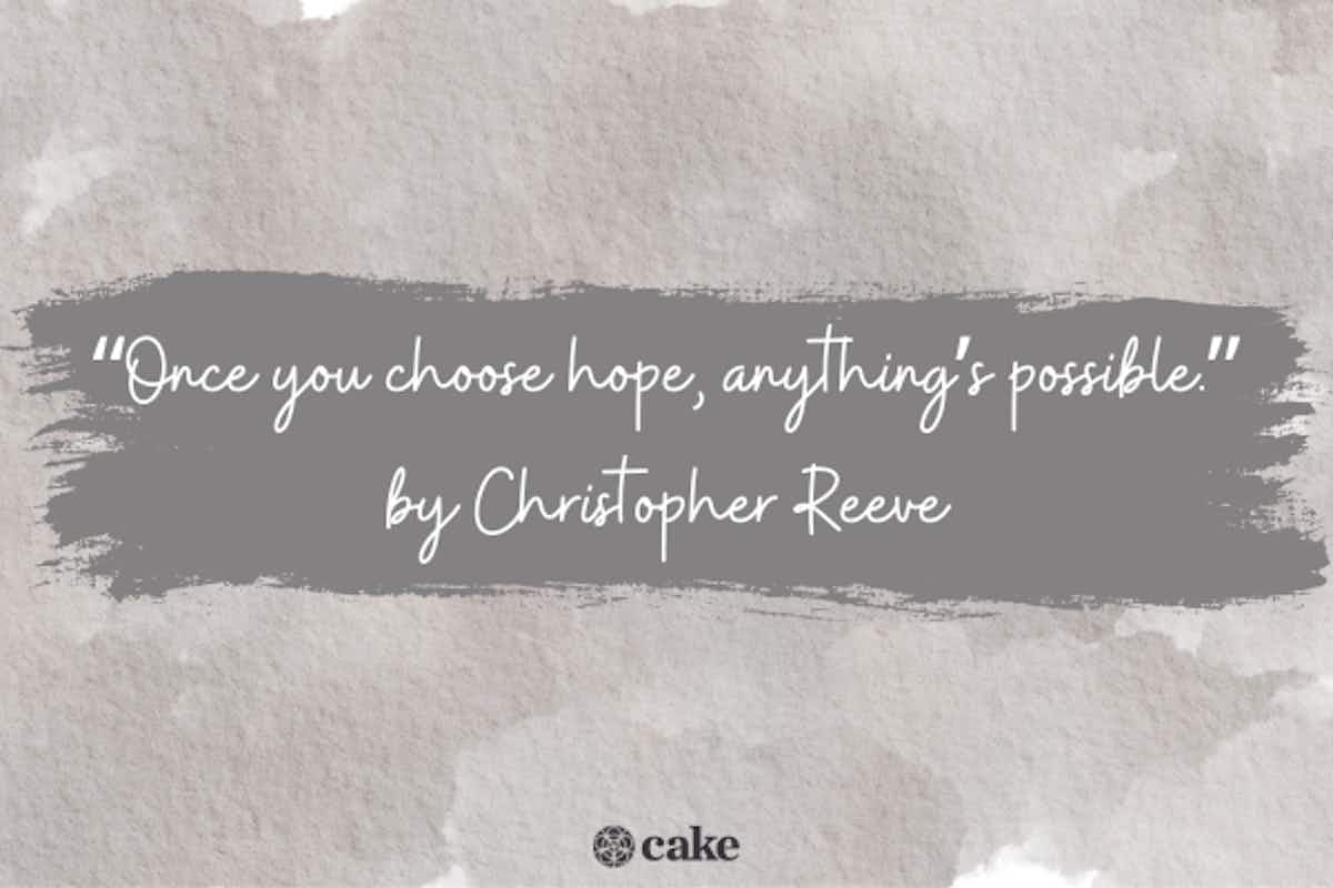 "Once you choose hope, anything's possible" by Christopher Reeve message on gray paper background