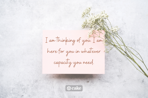 Sympathy message on a notecard with flowers